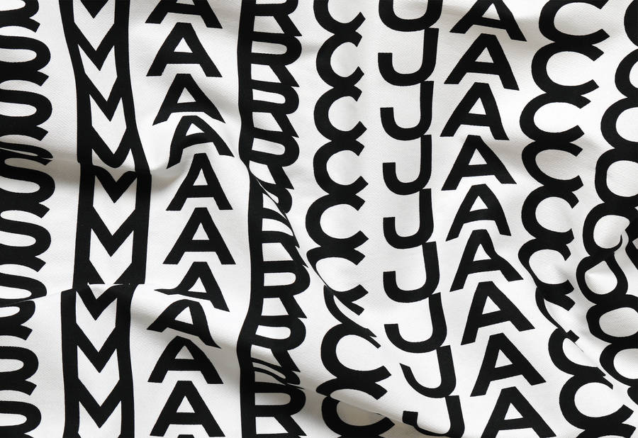 Designer Fabric With Marc Jacobs Logo Wallpaper