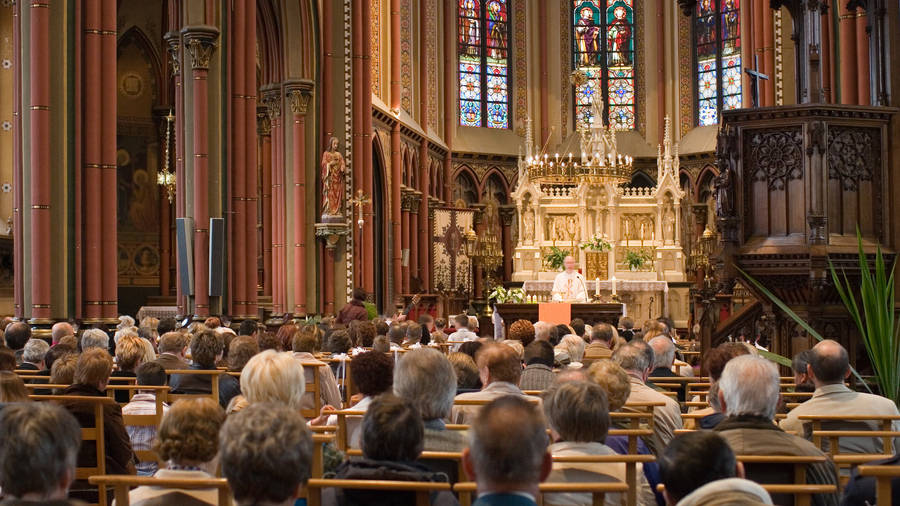 Devoted Worshippers In Holy Eucharist Celebration Wallpaper