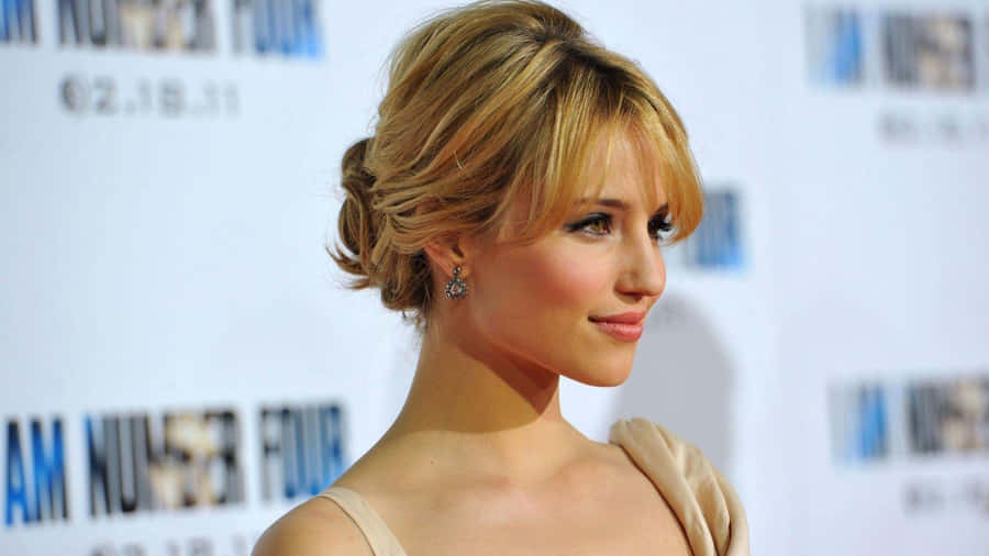 Dianna Agron Striking A Pose In A Classy Ensemble Wallpaper