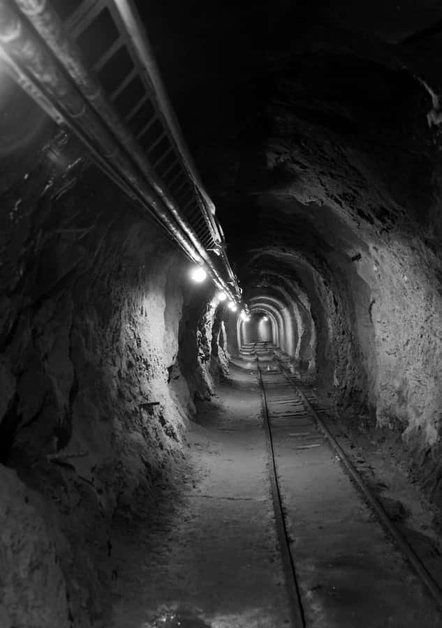 Dimly_ Lit_ Mining_ Tunnel Wallpaper