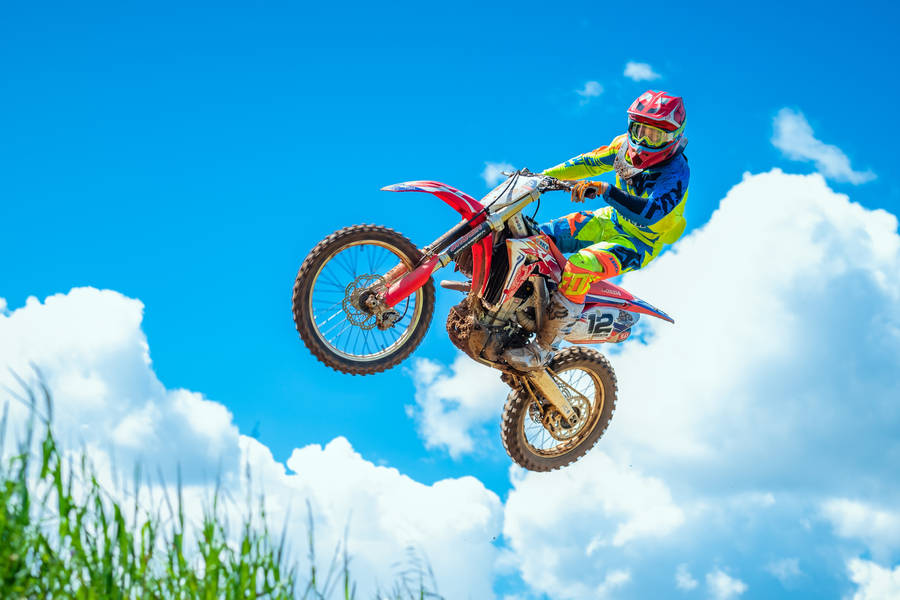 Dirt Bike And Clouds Wallpaper