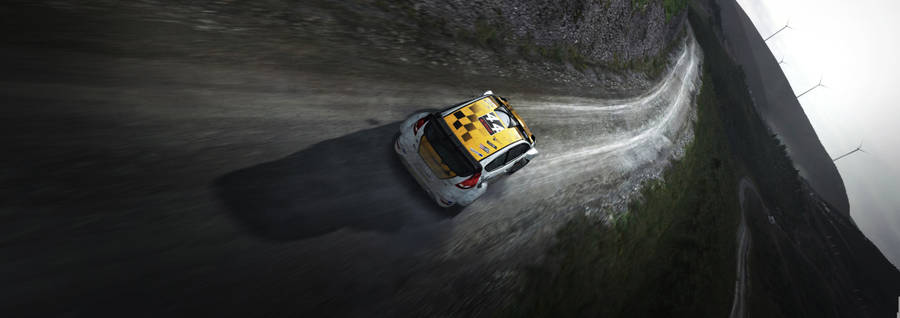 Dirt Rally Car In Muddy Road Wallpaper