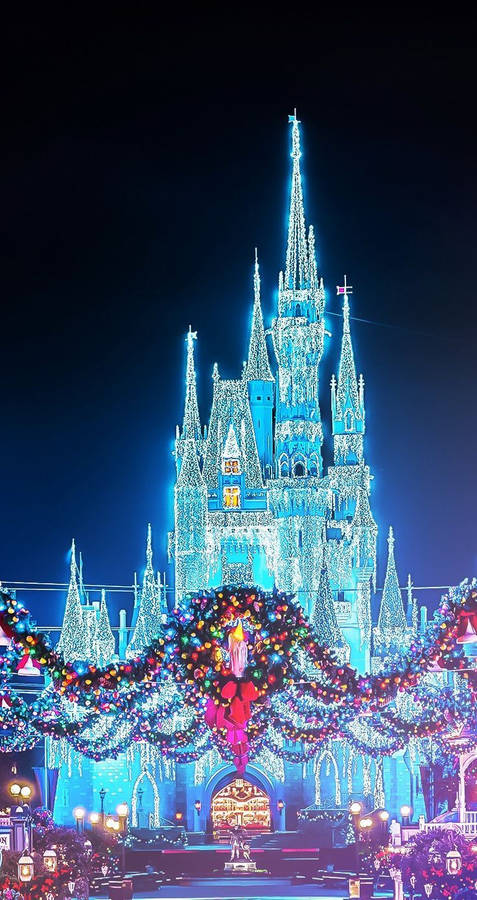 Disney Christmas Castle With Blue Lights Wallpaper