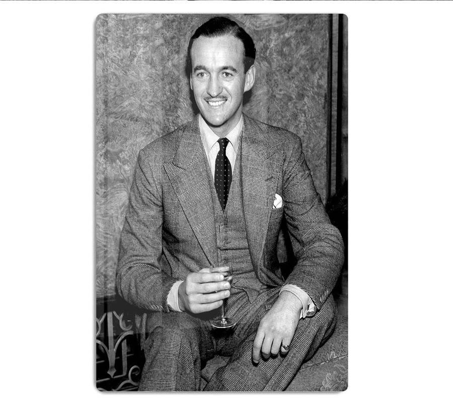 Distinguished British Actor David Niven Enjoying A Glass Of Wine Wallpaper