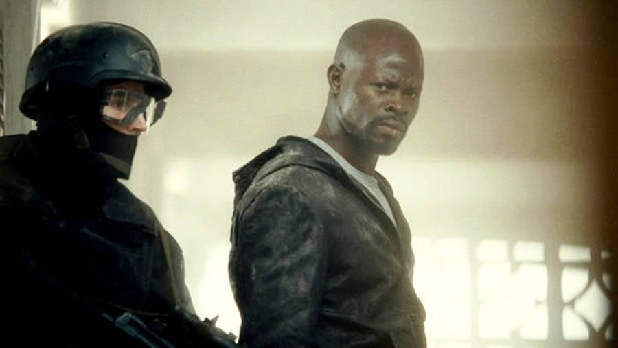 Djimon Hounsou With Armed Man Wallpaper