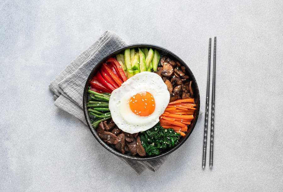 Dolsot Bibimbap On A Stone Counter Wallpaper