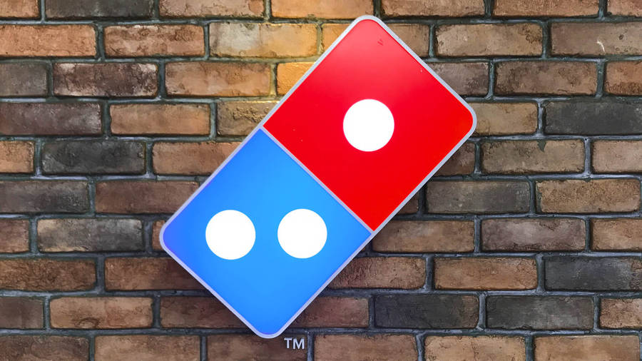 Dominos Pizza Logo On Brick Wall Wallpaper