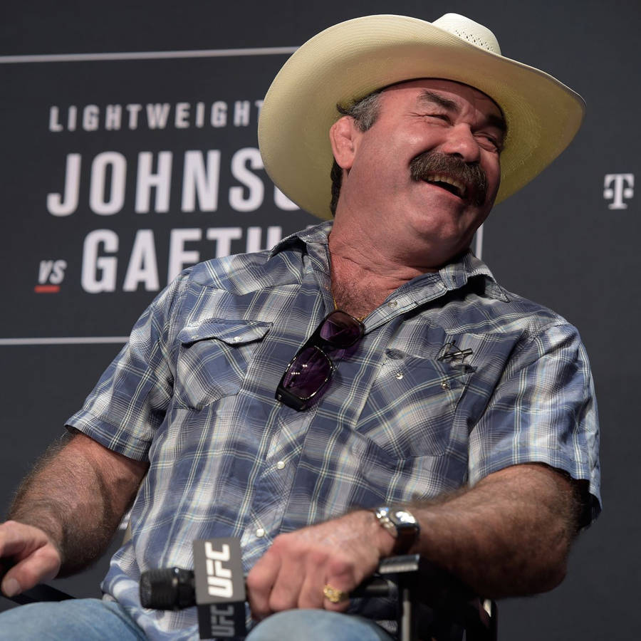 Don Frye Chuckling At A Conference Wallpaper