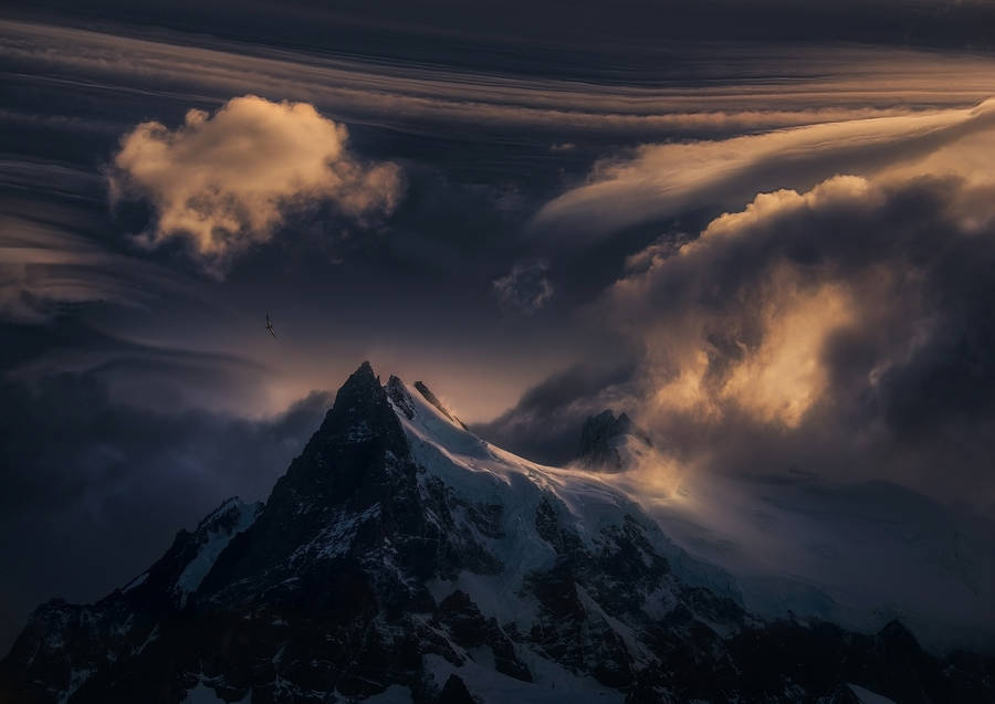 Dramatic Snow Mountain Top Wallpaper