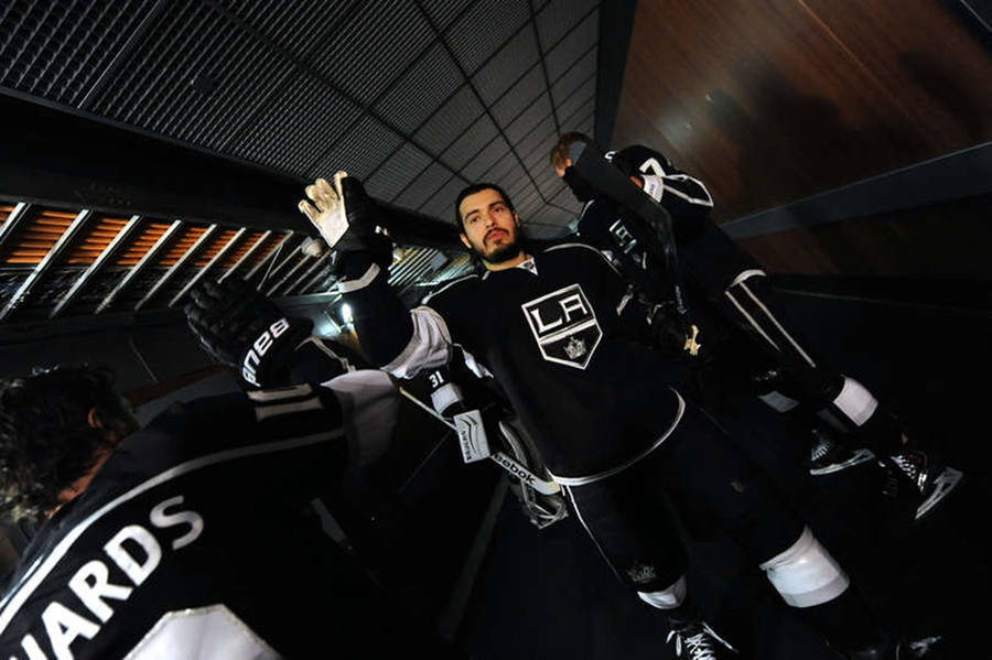 Drew Doughty Hands Up To High Five Teammate Mike Richards Wallpaper