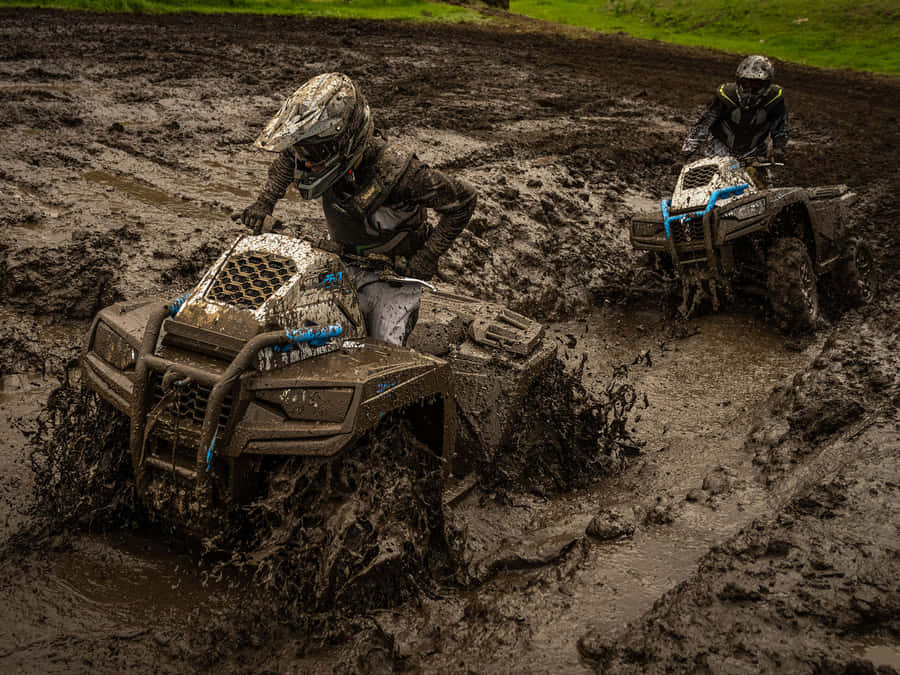 Driving 2023 Arctic Cat Alterra 600 Mud Pro Wallpaper