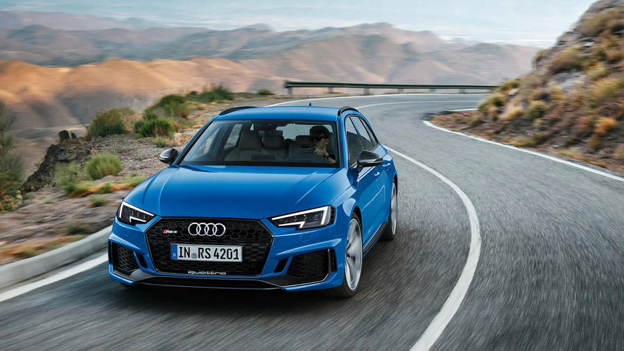 Driving A Blue Audi Rs 4 Wallpaper