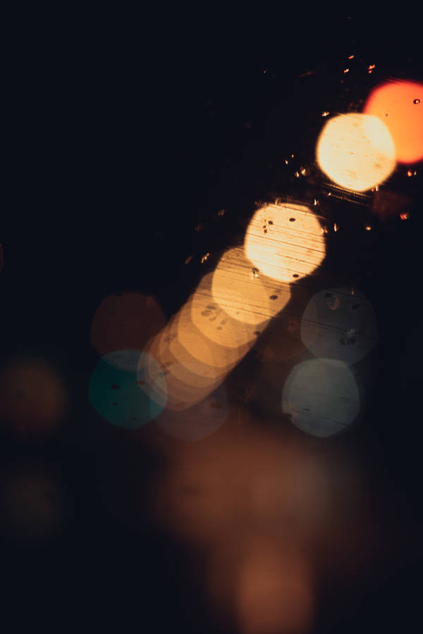 Drizzling Window With Streetlight Bokeh Wallpaper