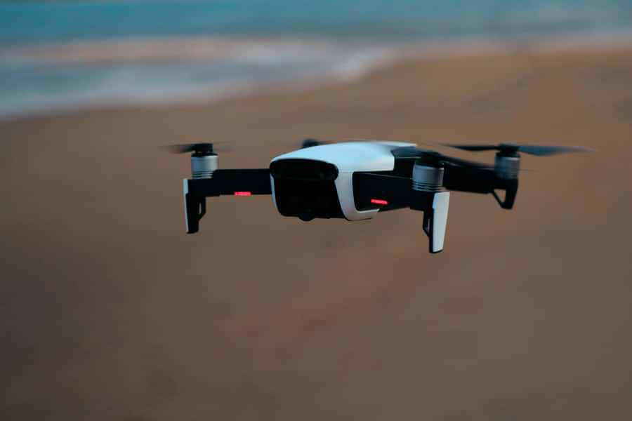 Drone In Flight Over Beach Wallpaper