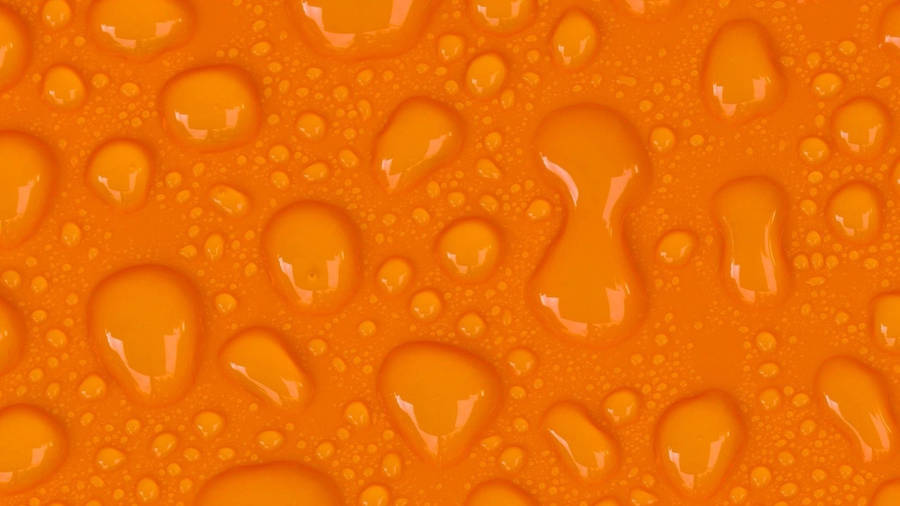 Droplets On An Orange Background Wallpaper