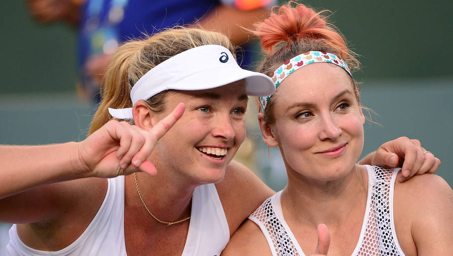 Dynamic Duo - Bethanie Mattek-sands And Coco Vandeweghe In Competition Wallpaper