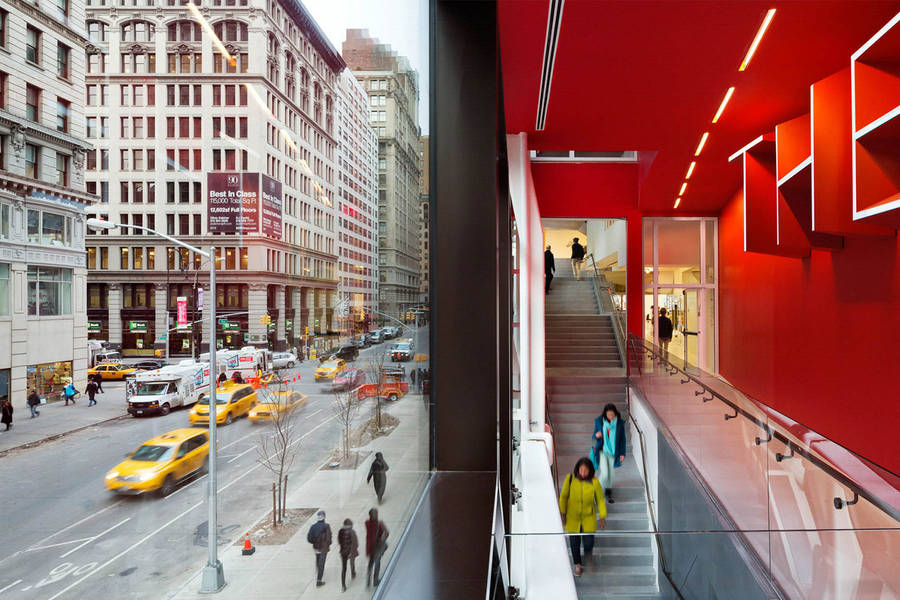 Dynamic View Of The New School In Vibrant New York Streetscape. Wallpaper