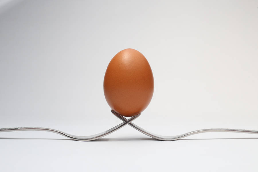 Egg Balanced On Forks Wallpaper