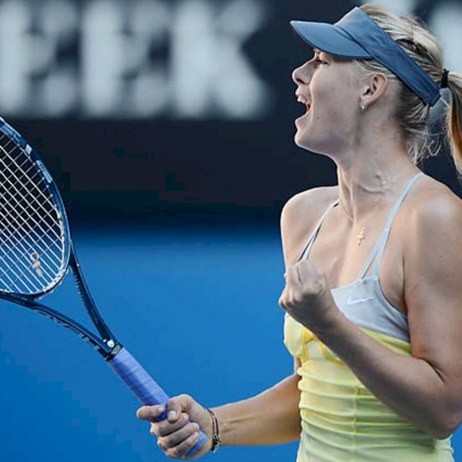 Ekaterina Makarova Celebrating A Tennis Victory With A Fist Pump Wallpaper