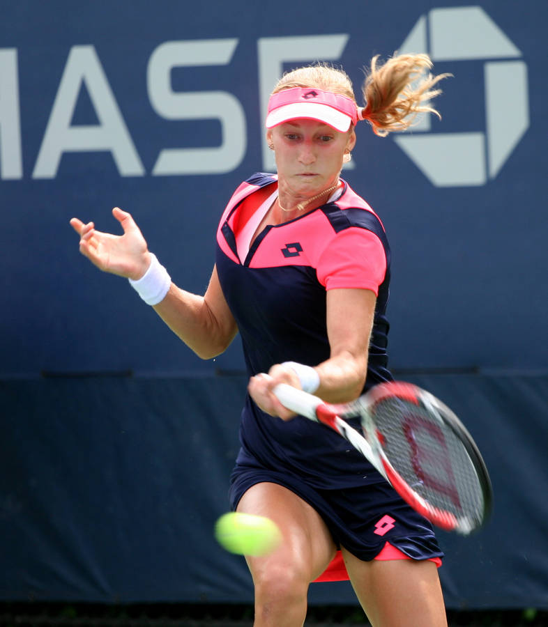 Ekaterina Makarova In Action During Tennis Match Wallpaper