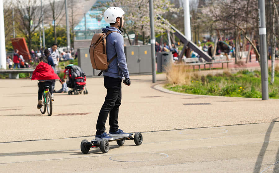 Electric Skateboard Riderin Park Wallpaper