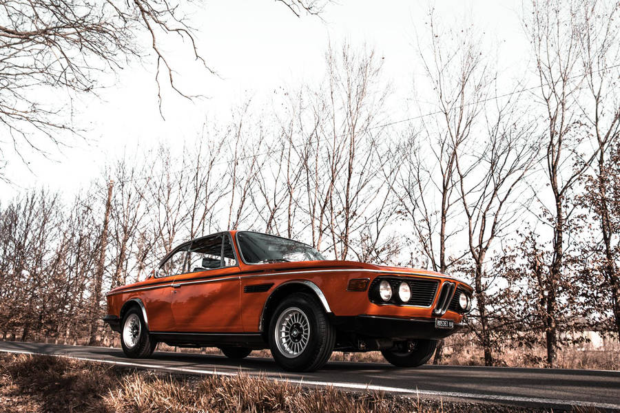 Elegant 1971 Classic Bmw Shining Under Bright Lights Wallpaper