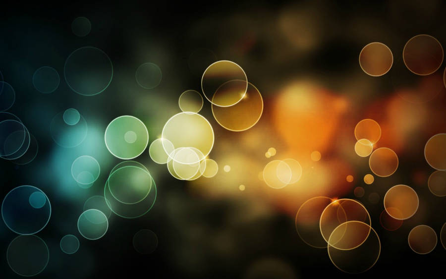 Elegant Apple Macbook Air Illuminated By Sparkly Bokeh Lights Wallpaper