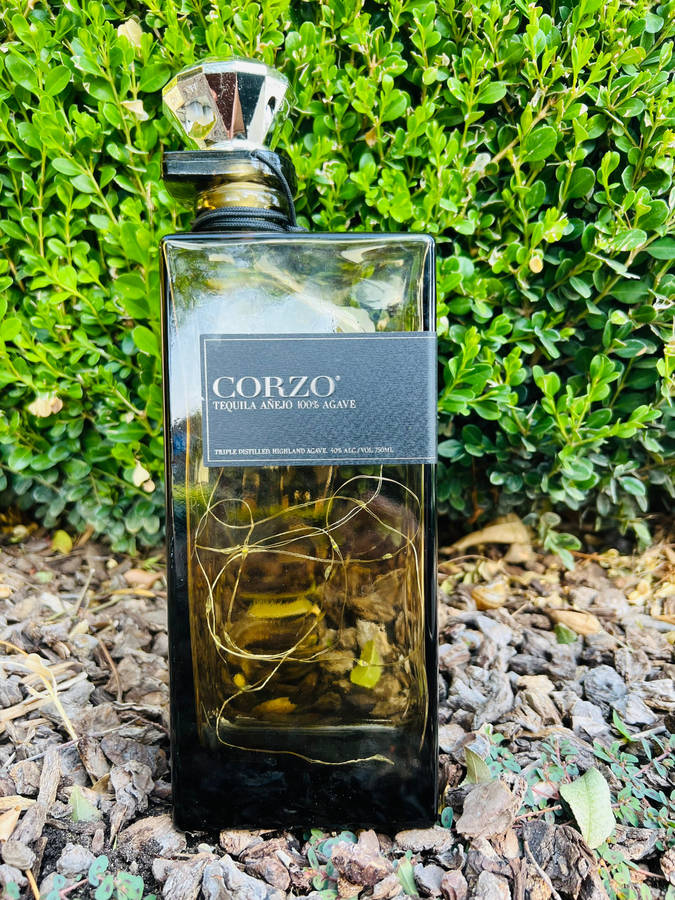 Elegant Bottle Of Corzo Anejo Tequila Wallpaper