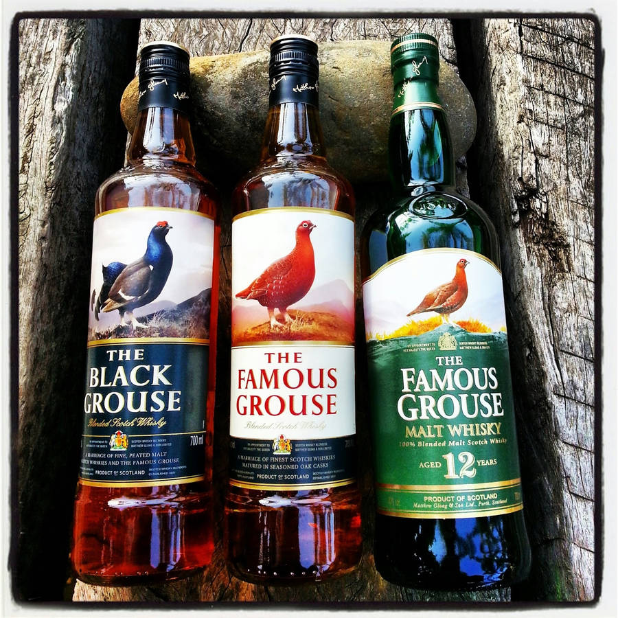 Elegant Bottle Of Famous Grouse Black Grouse 12 Years Malt Whisky Wallpaper