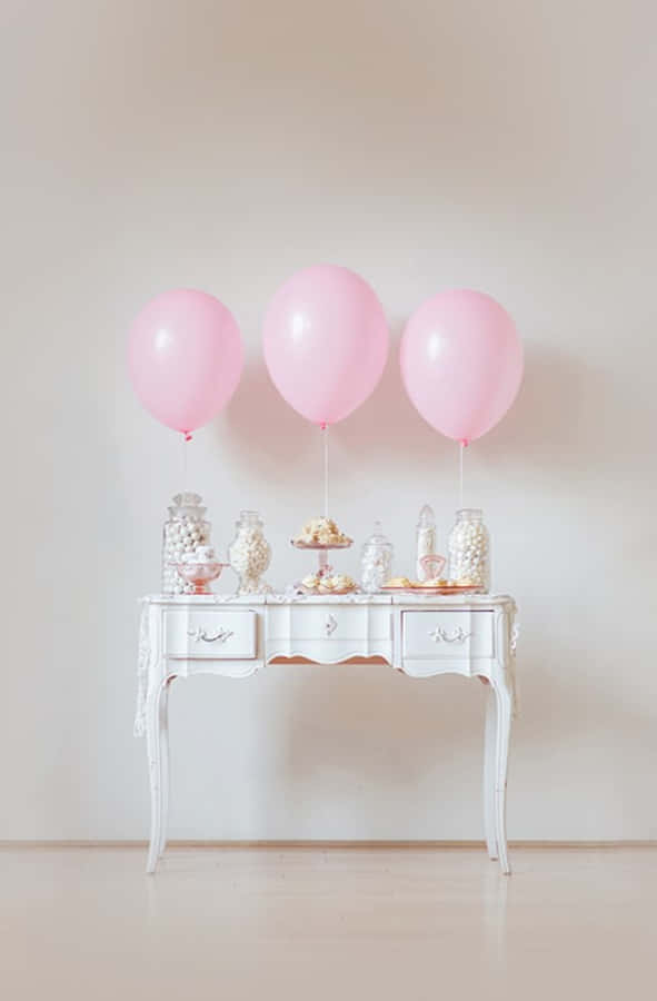 Elegant Pink Birthday Party Setup Wallpaper