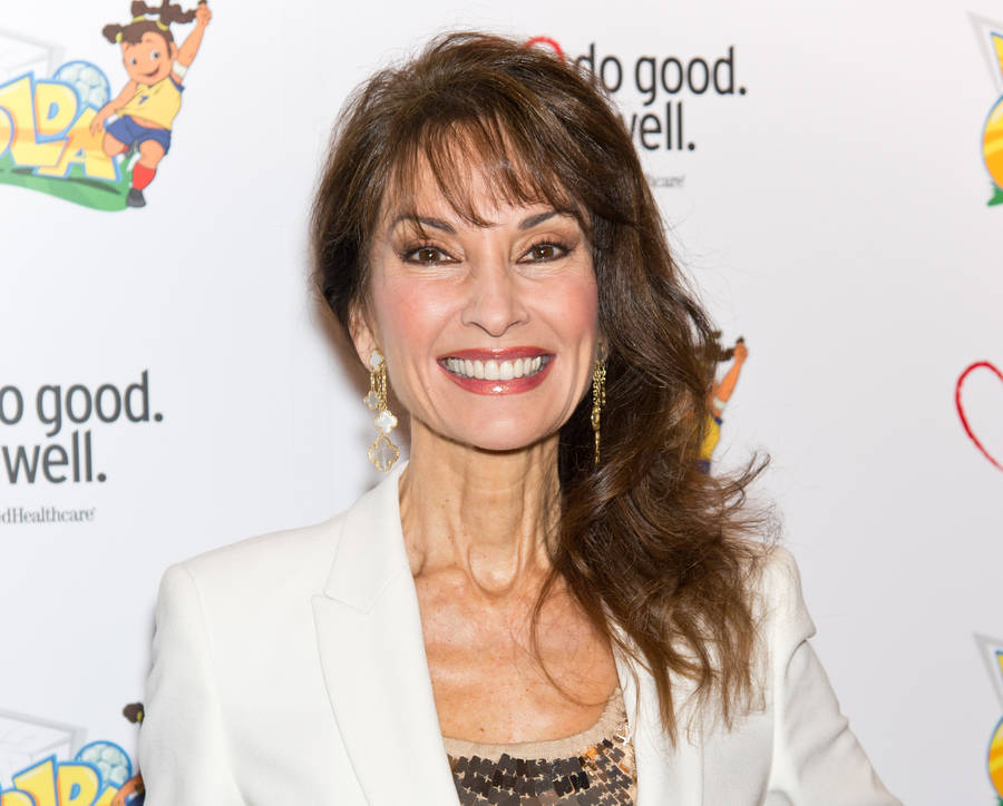 Elegant Susan Lucci Dazzles In White Dress Wallpaper