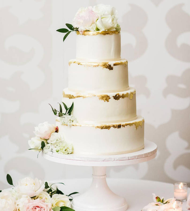 Elegant White And Gold Trimmed Wedding Cake Wallpaper