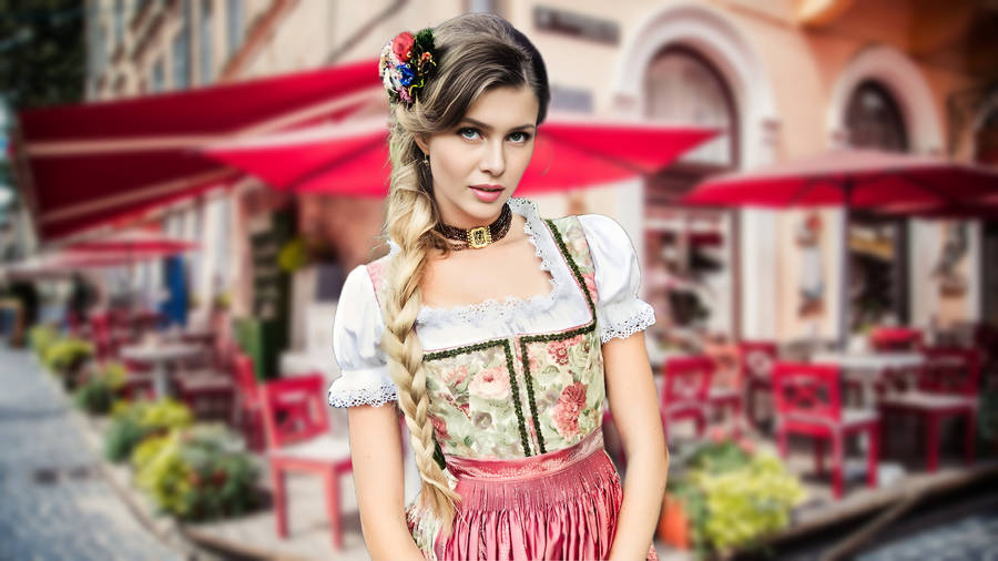 Elegant Woman In Traditional Dirndl Dress Celebrating Oktoberfest Wallpaper