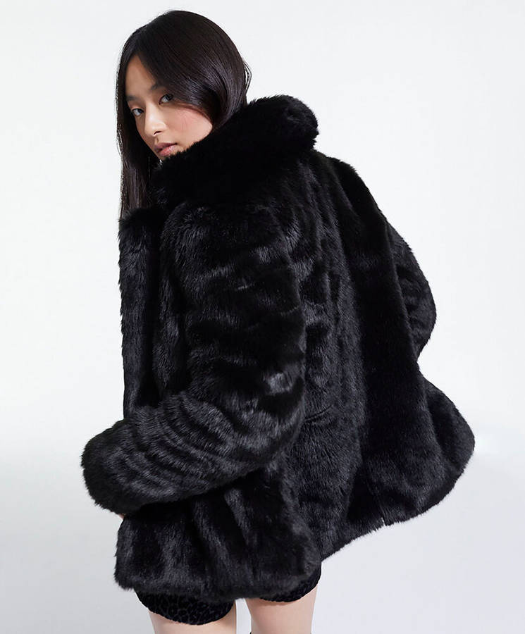 Elevate Your Style With The Kooples Black Fur Coat Wallpaper