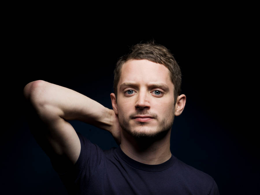 Elijah Wood On Black Background Wallpaper