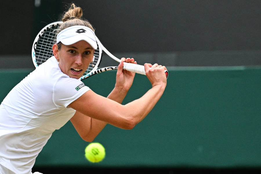 Elise Mertens In Action During A Tennis Match Wallpaper