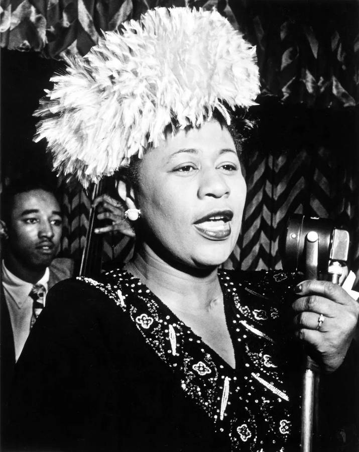 Ella Fitzgerald Holding A Microphone Wallpaper