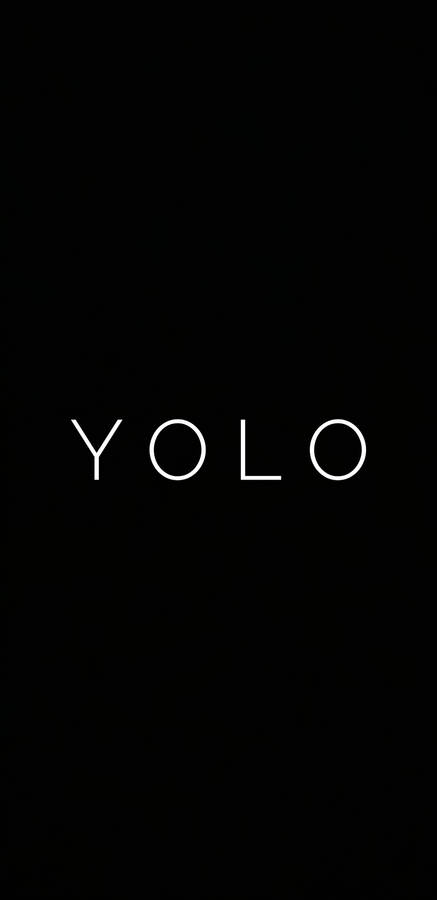 Embrace Life With 'yolo' Motivation On A Black Backdrop Wallpaper