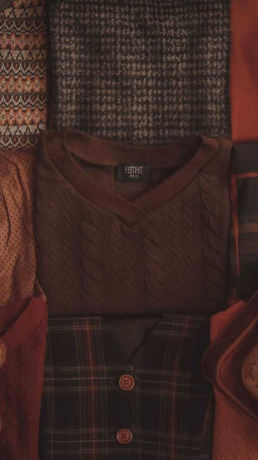 Embrace The Serenity Of Dark Brown Aesthetic Sweater Wallpaper