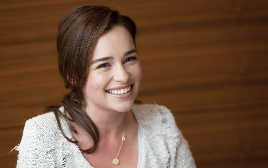 Emilia Clark Smiling Brightly Wallpaper