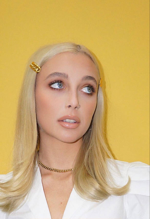 Emma Chamberlain On Yellow Wallpaper