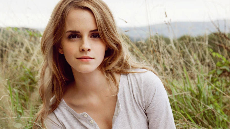 Emma Watson In Grassfield Wallpaper