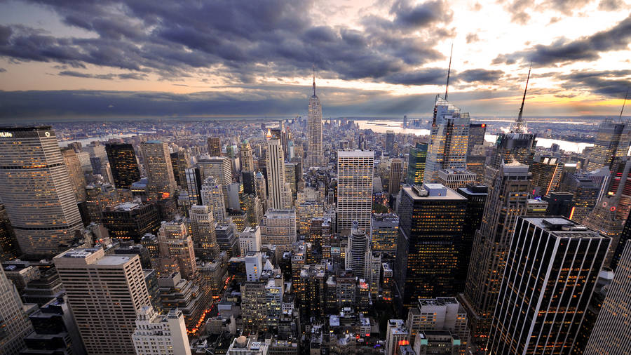 Empire State Buildings On Cloudy Sky Wallpaper