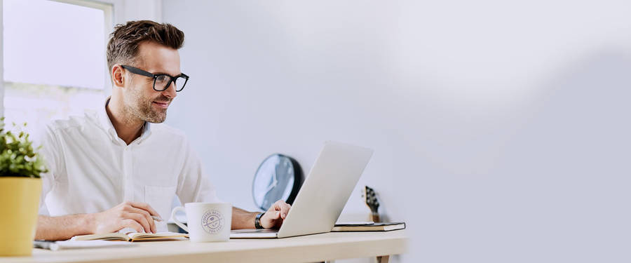 Employee's Coffee Bean Mug And Laptop Wallpaper