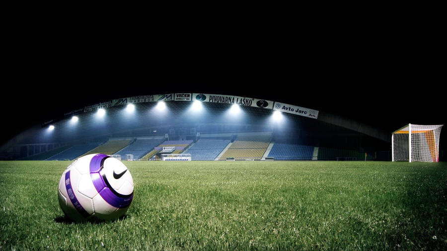 Empty Stadium And A Football Hd Wallpaper