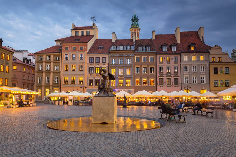 Enchanting Night View Of Poland's Old Town Wallpaper