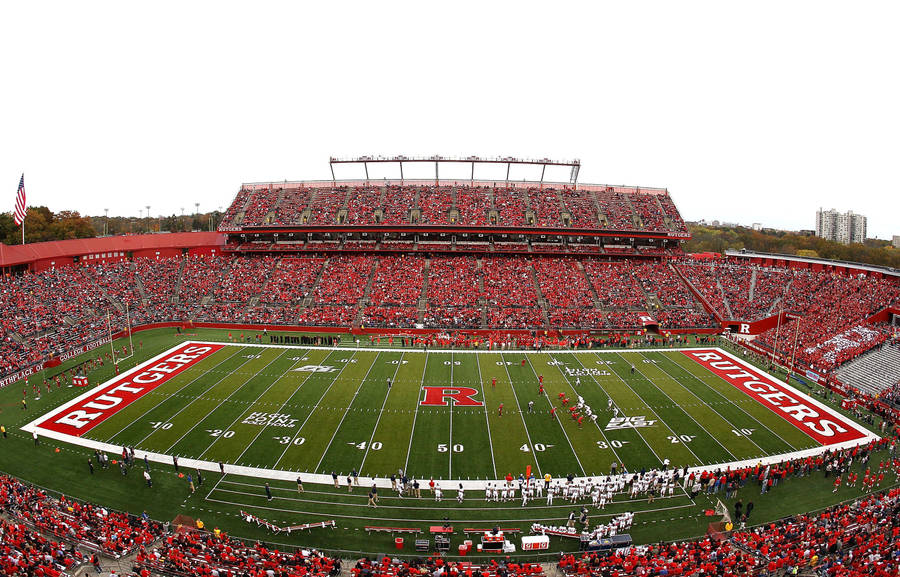 Energized Crowd At Rutgers Scarlet Knights Football Game Wallpaper