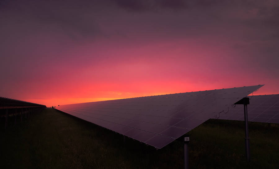 Energy Panels Under A Rosy Sky Wallpaper