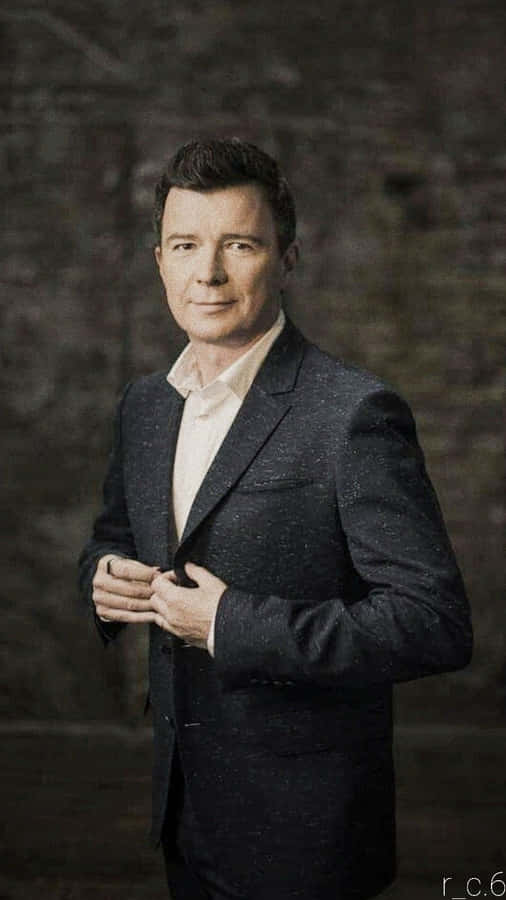 English Musician Rick Astley Performing On Stage Wallpaper