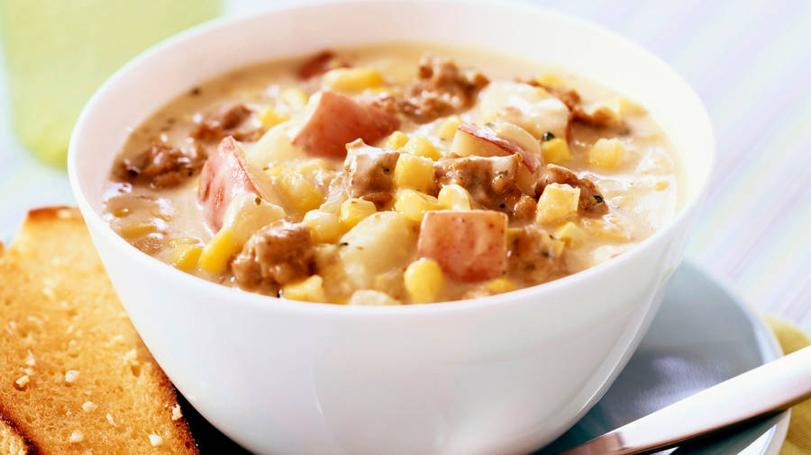 Enjoy A Hearty Beefy Chowder With Corn Wallpaper